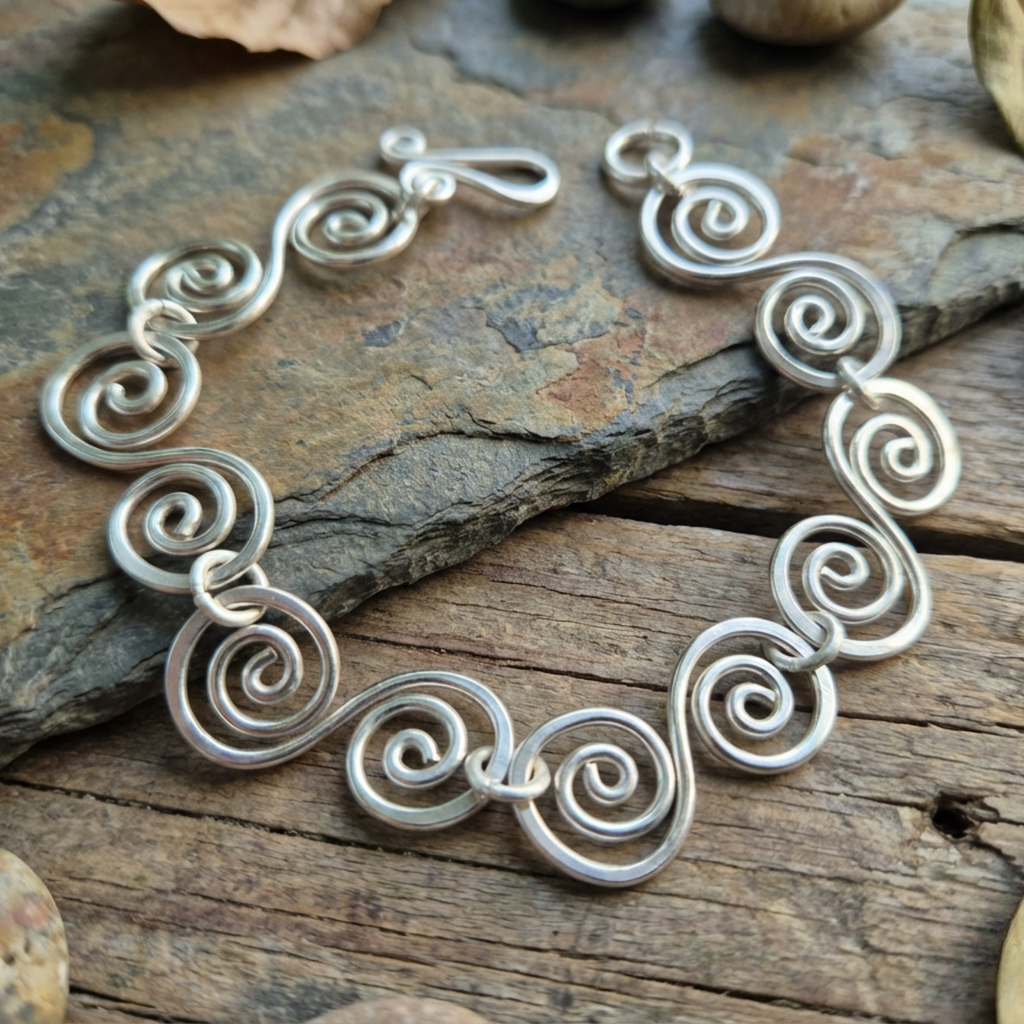 Large statement Celtic Spiral bracelet on slate and wood