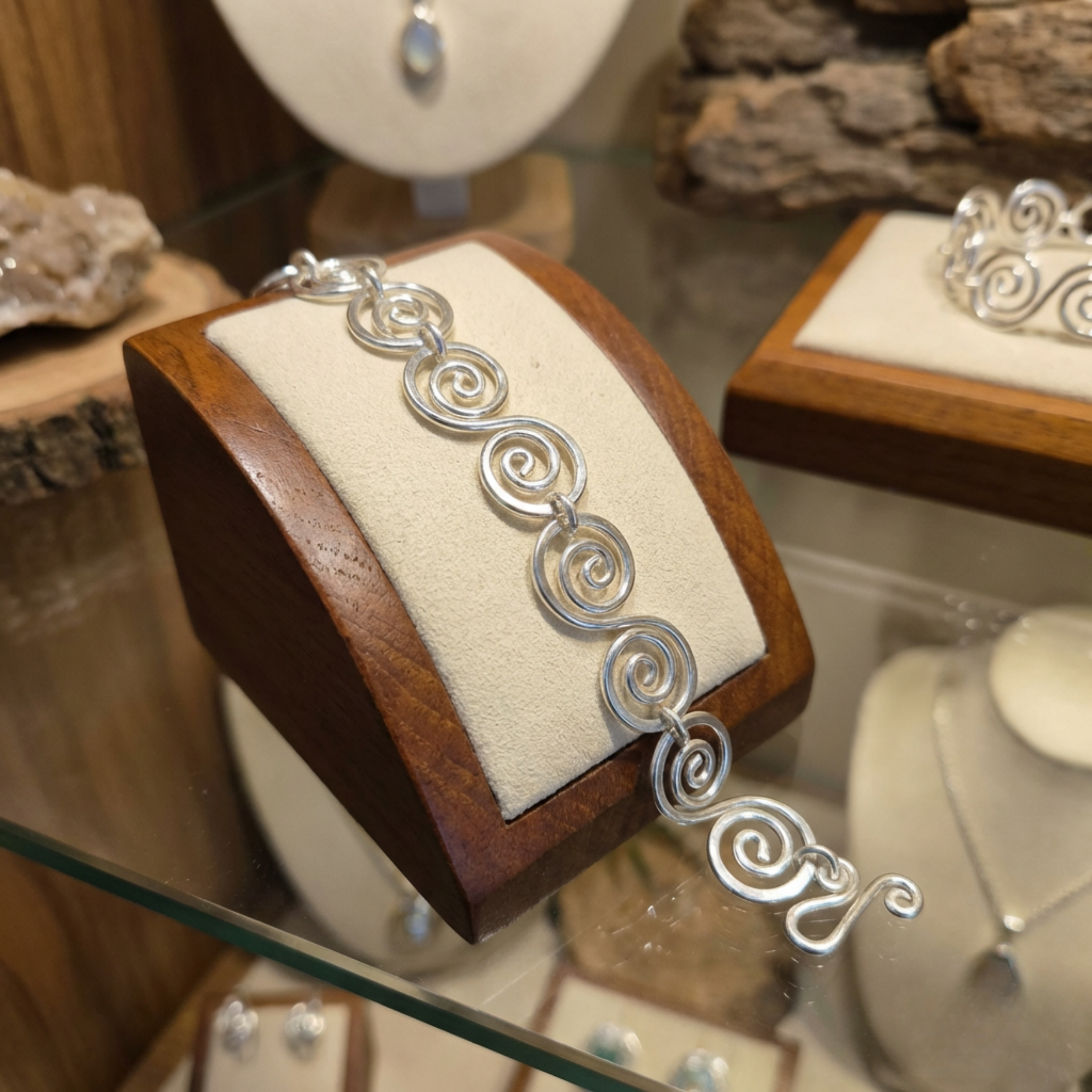 Silver spiral bracelet on a shop display