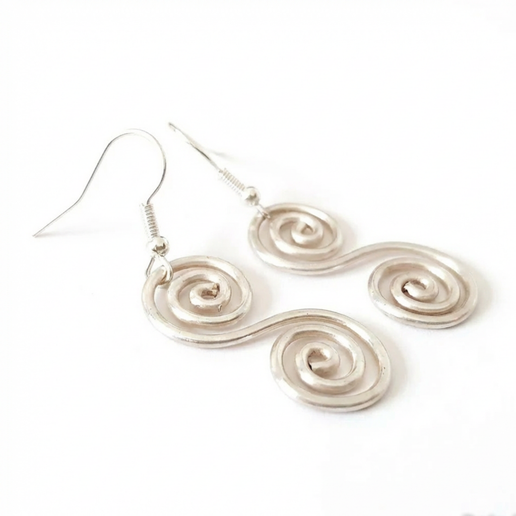 Silver spiral earrings on a white background