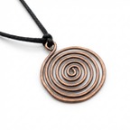 Copper spiral pendant on a black cord against a white background