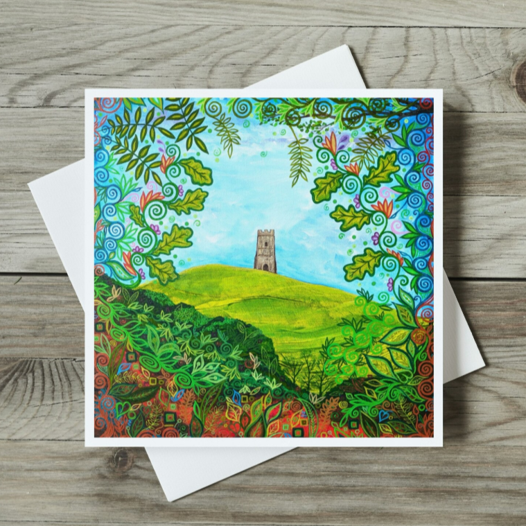 Colourful landscape painting of Glastonbury Tor with a tower on a hill looking through the trees Greeting Card on a wooden surface