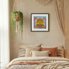 Decorative bedroom with a bed, pillows, and wall art.