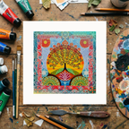 Colourful artwork of a tree on a wooden surface with art supplies.