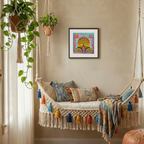 Decorative indoor swing with colourful pillows and a framed artwork on the wall.