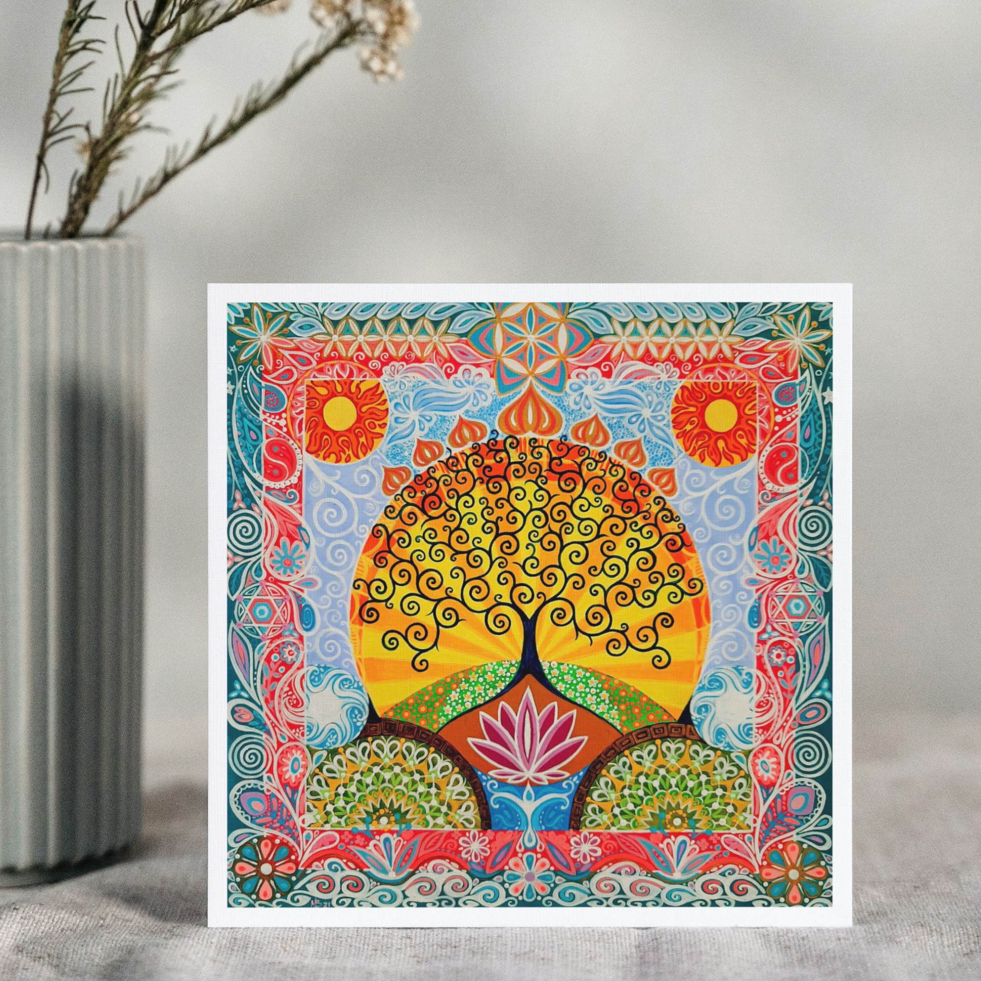 Colorful abstract art print with a tree and lotus flower on a gray surface.