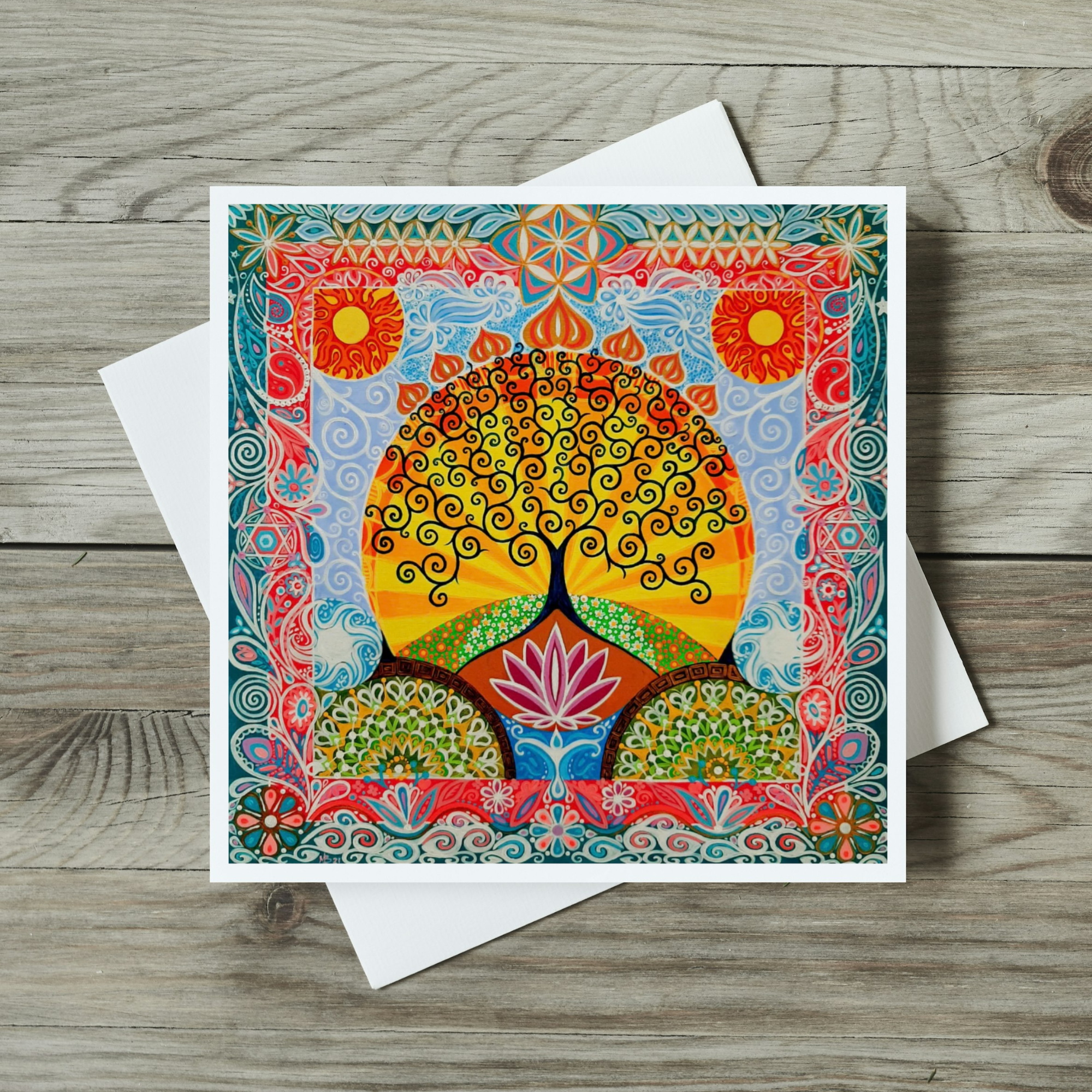 Colorful greeting card with a tree design on a wooden surface