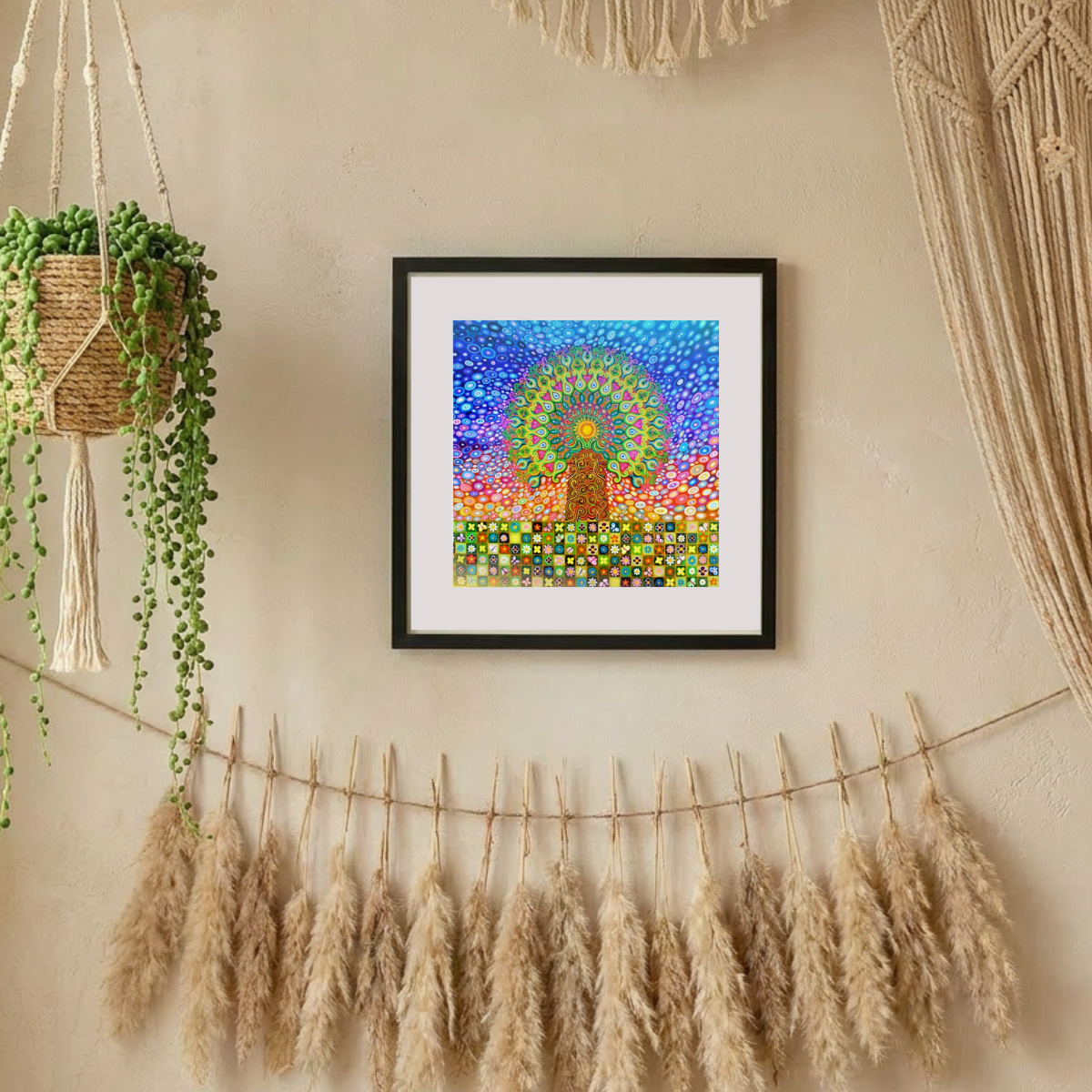 Framed colourful abstract mandala Tree of life art piece on a wall with hanging plants and pampas grass.