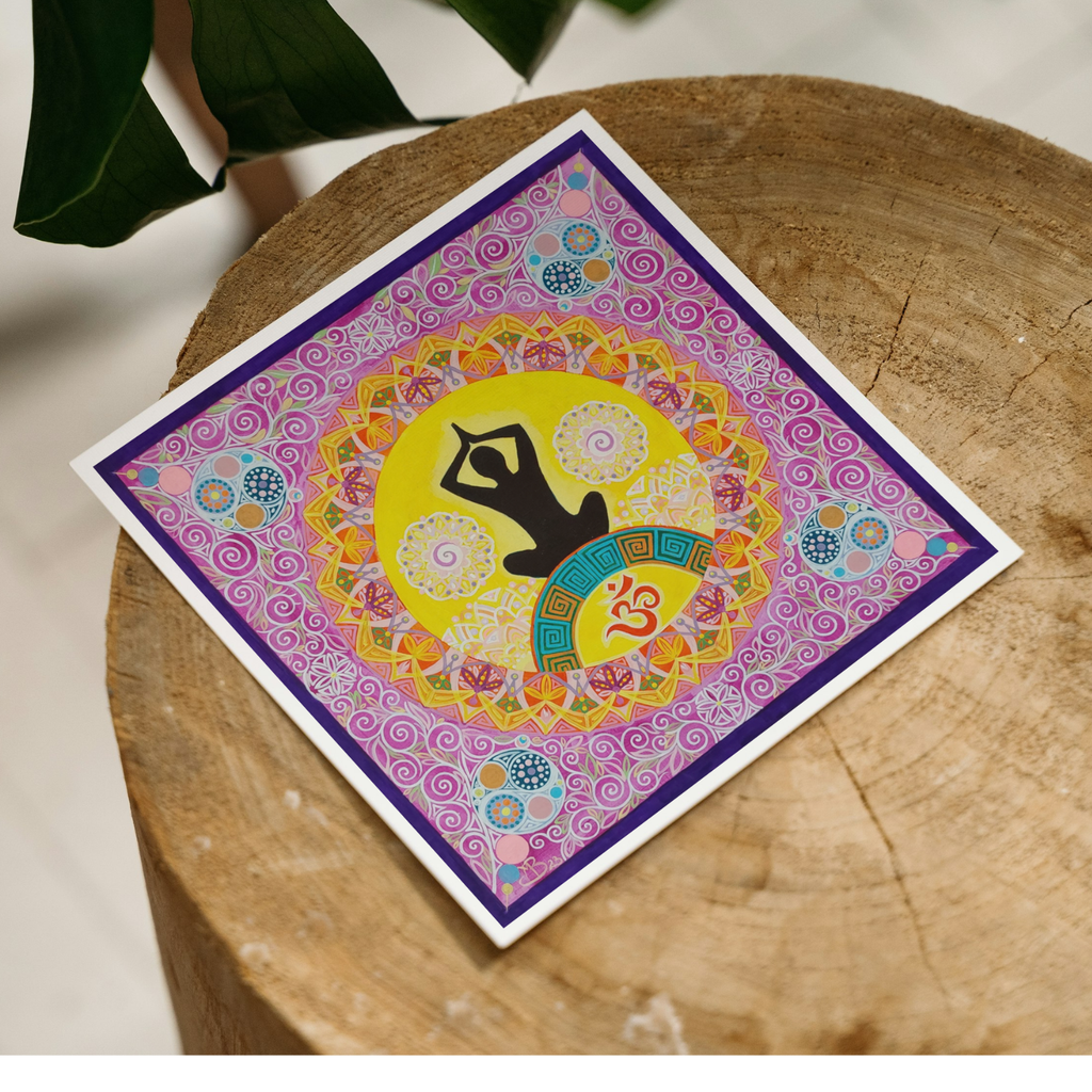 Colorful card with a yoga pose design on a wooden surface