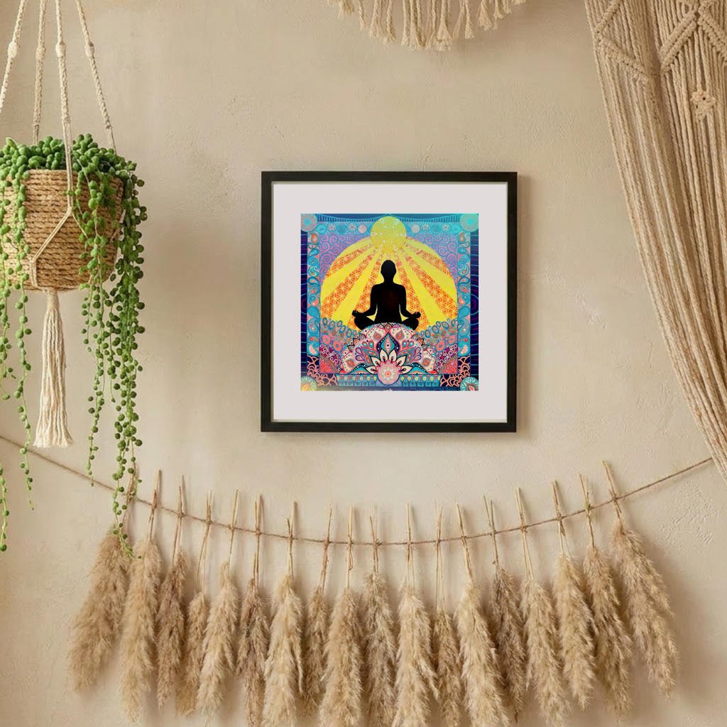 Framed artwork of a meditating figure with a colourful background on a wall with decorative elements.