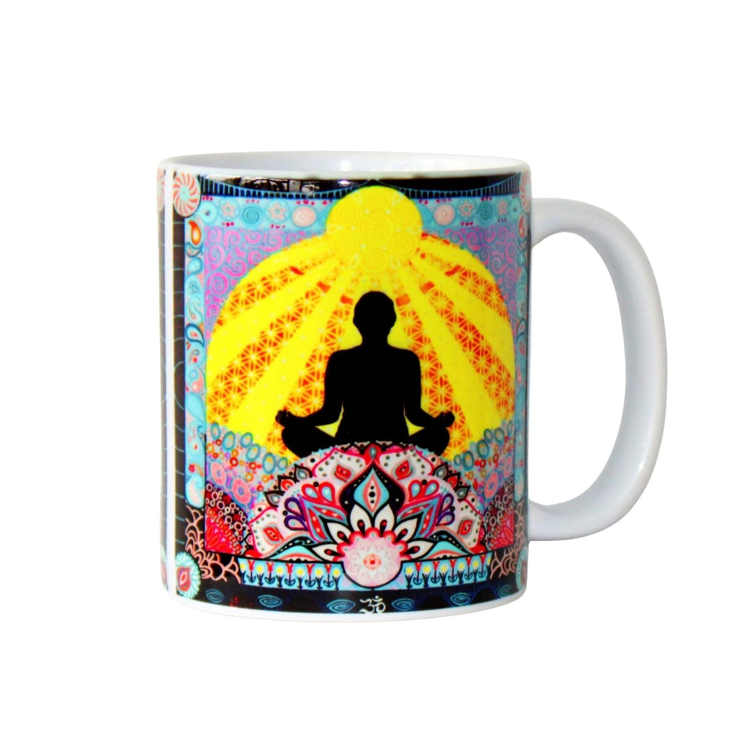 Mug with a colourful design featuring a meditating figure and floral patterns on a white background.