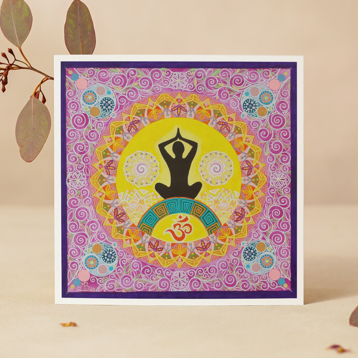 Decorative greeting card with a yoga pose and Om symbol on a colourful patterned mandala background