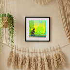Framed artwork on a wall with decorative elements like potted plants and dried grasses.