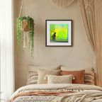 Cozy bedroom with a bed, decorative pillows, hanging plant, and wall art.