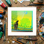 Colourful artwork of a tree and hare on a wooden surface with art supplies.