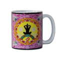 Mug with yoga-themed design featuring a mandala and OM symbol on a colourful background.