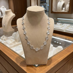 Silver Spiral necklace on a mannequin bust in a jewellery store setting