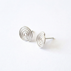 Silver spiral earrings on a white background