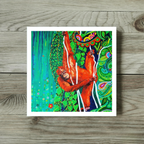 Colourful artwork of an orangutan on a wooden surface