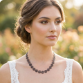 Woman wearing a earthy copper necklace with a blurred natural background