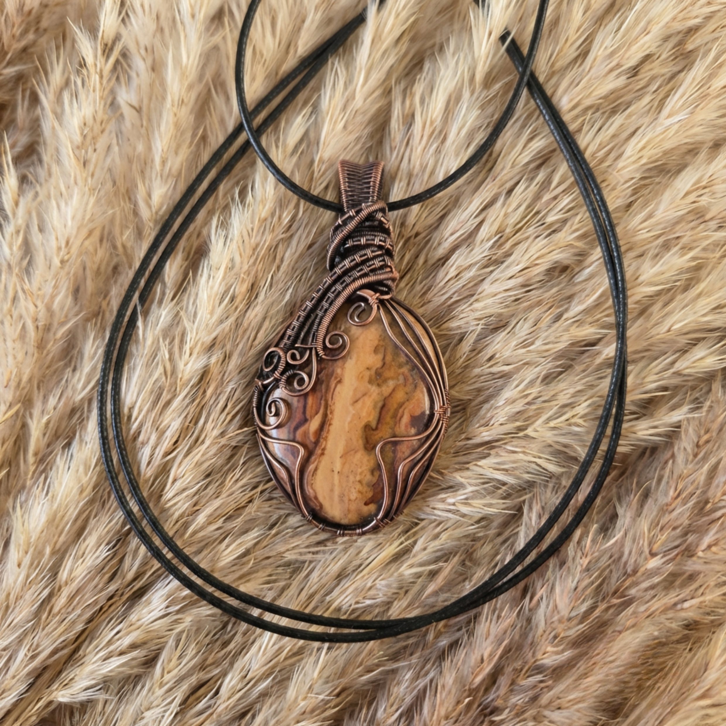 Decorative pendant necklace on a textured fur surface