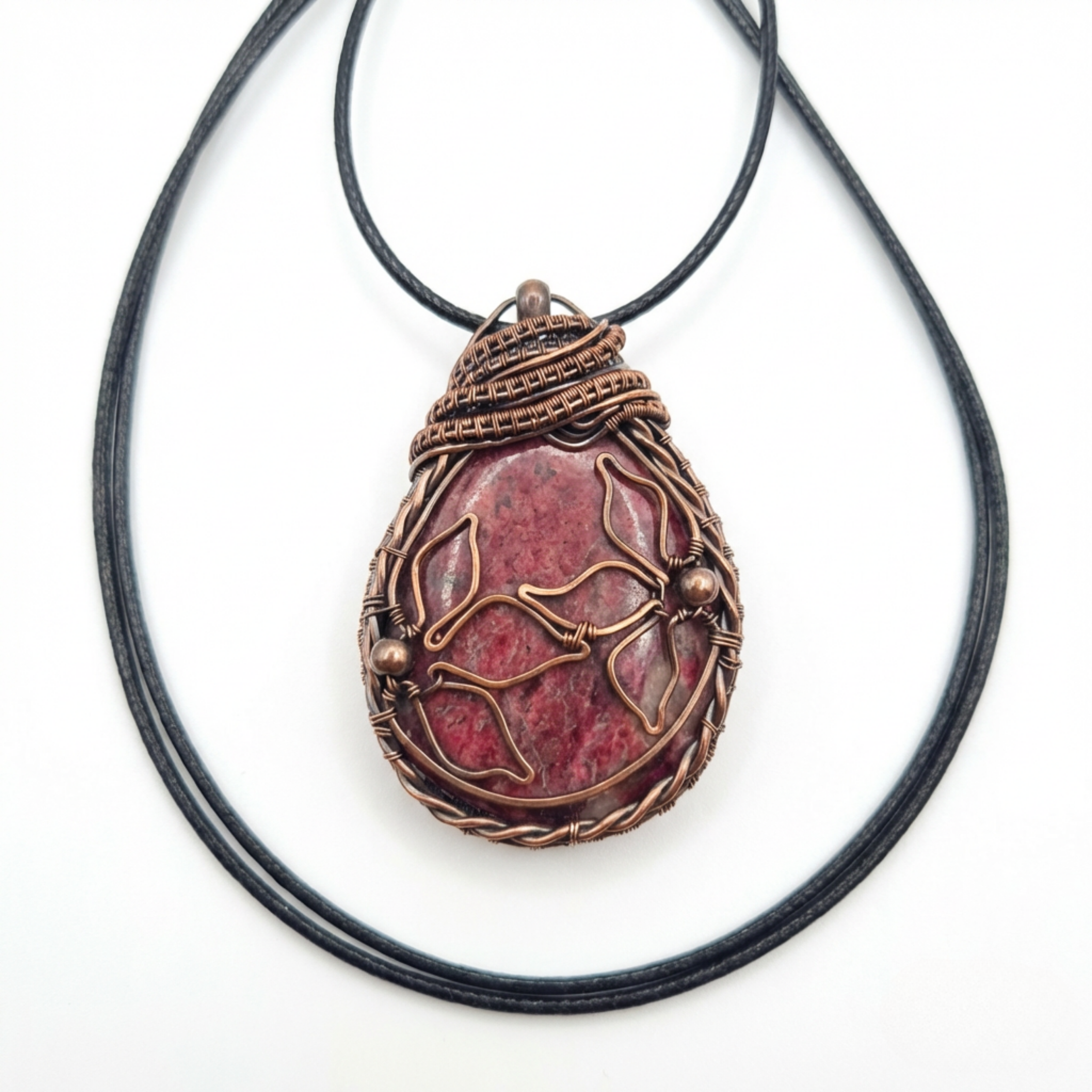 Rhodonite copper pendant on a white background