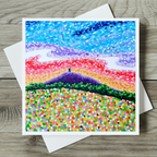 Colourful abstract landscape painting of Glastonbury Tor on a wooden surface