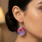 model wearing silver purple pink gold round dangle drop earrings
