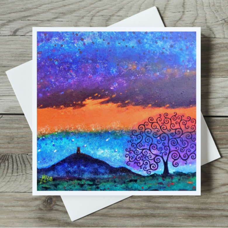 Colourful abstract landscape painting on a wooden surface