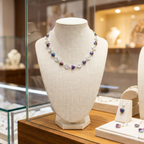 Necklace on a mannequin bust in a jewelry store setting
