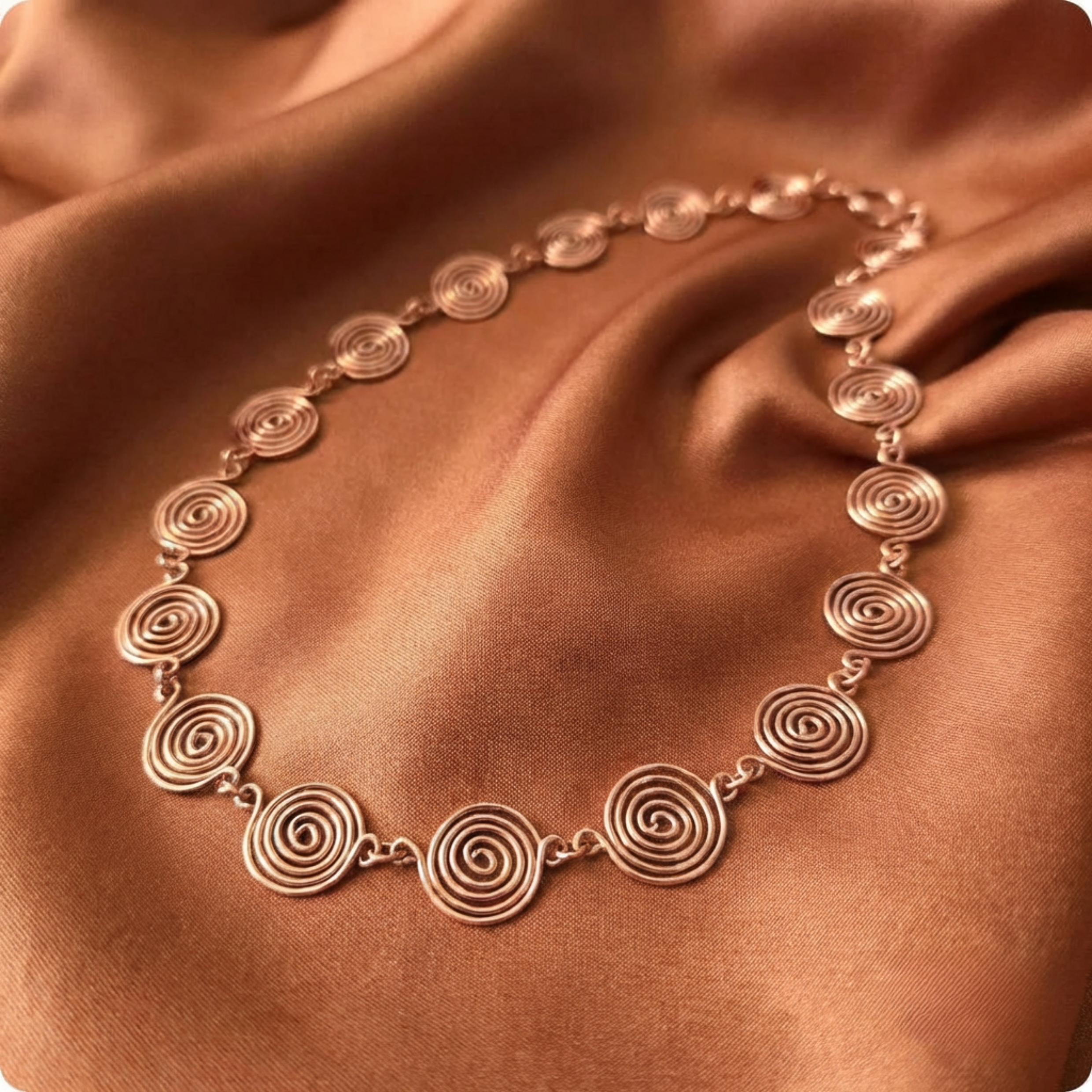 Raw Copper necklace on a brown fabric background