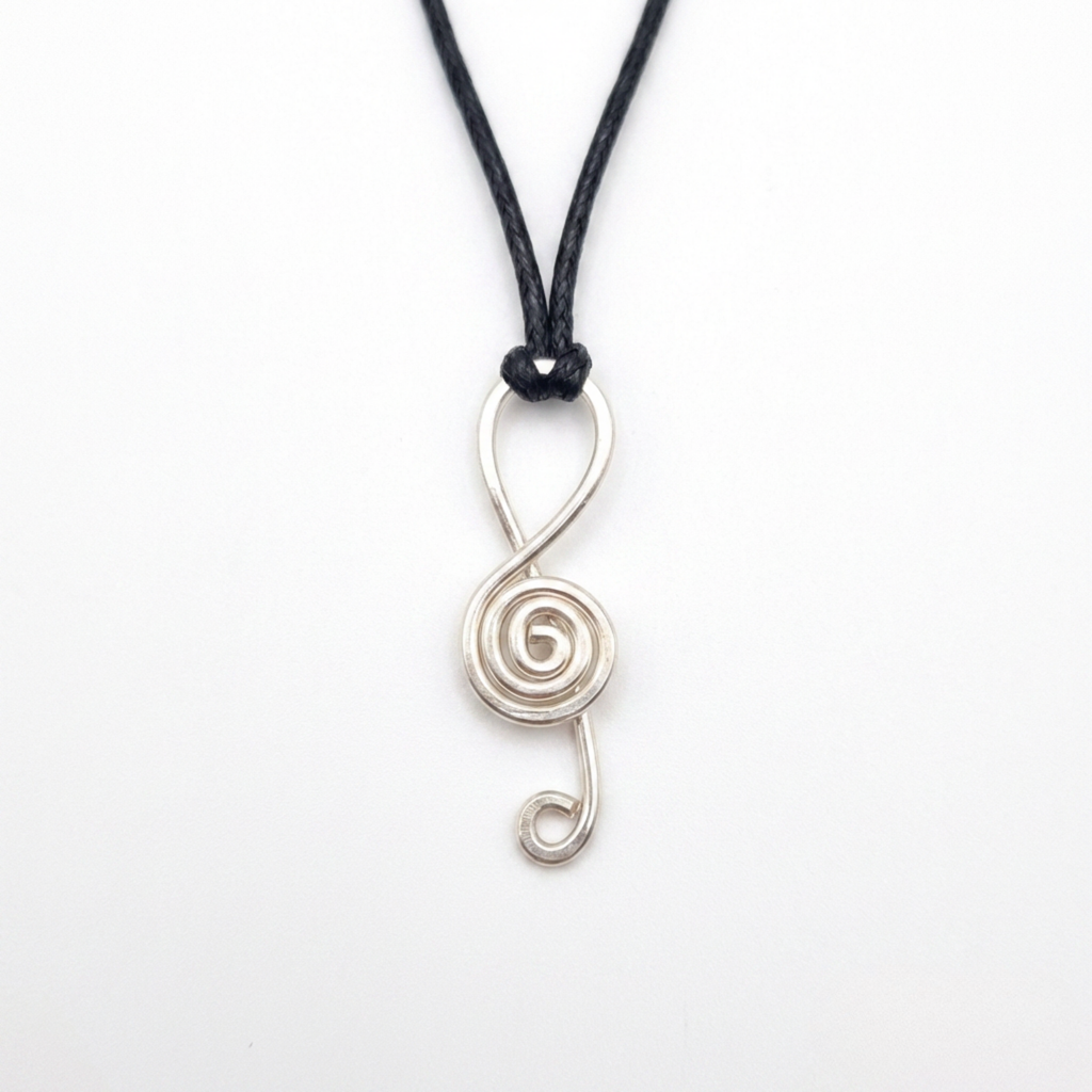 Silver spiral pendant on a black cord against a white background