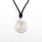 Silver spiral pendant on a black cord against a white background