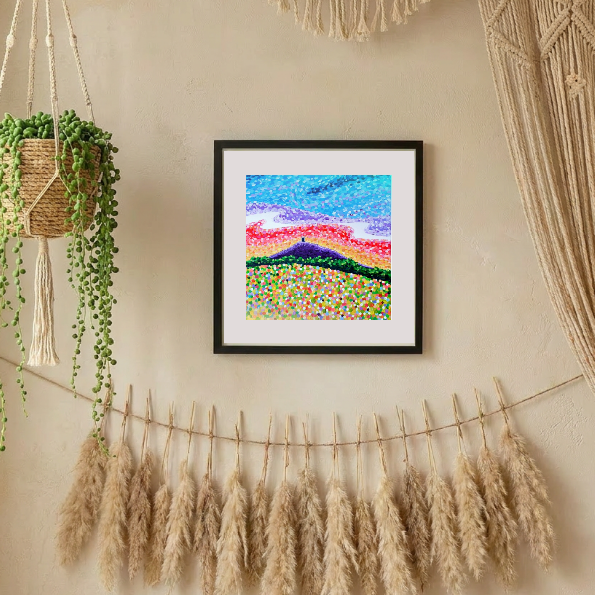 Framed abstract artwork on a wall with decorative elements