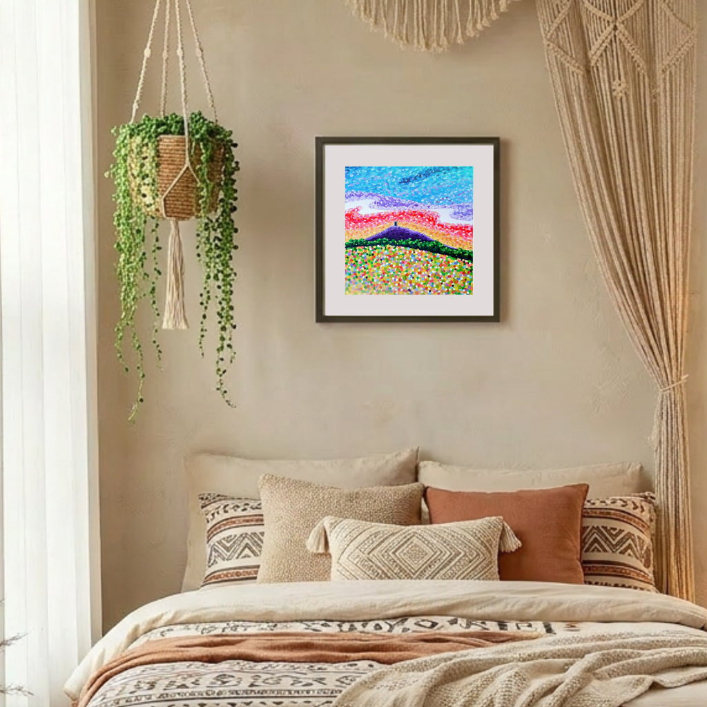 Cozy bedroom with a bed, pillows, and Glastonbury Tor  wall art, featuring a hanging plant and macrame decorations.