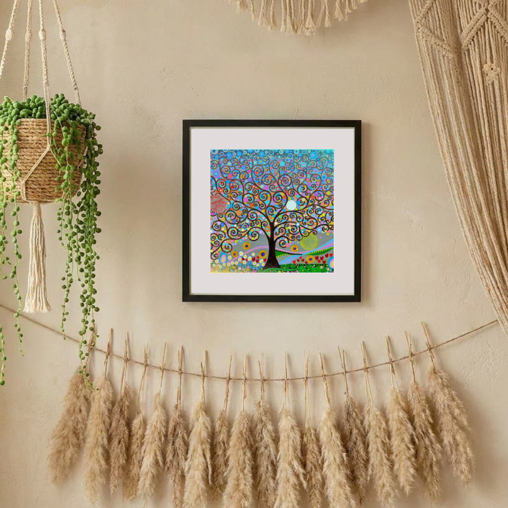 Framed colourful artwork of a tree on a wall with pampas grass and plants.