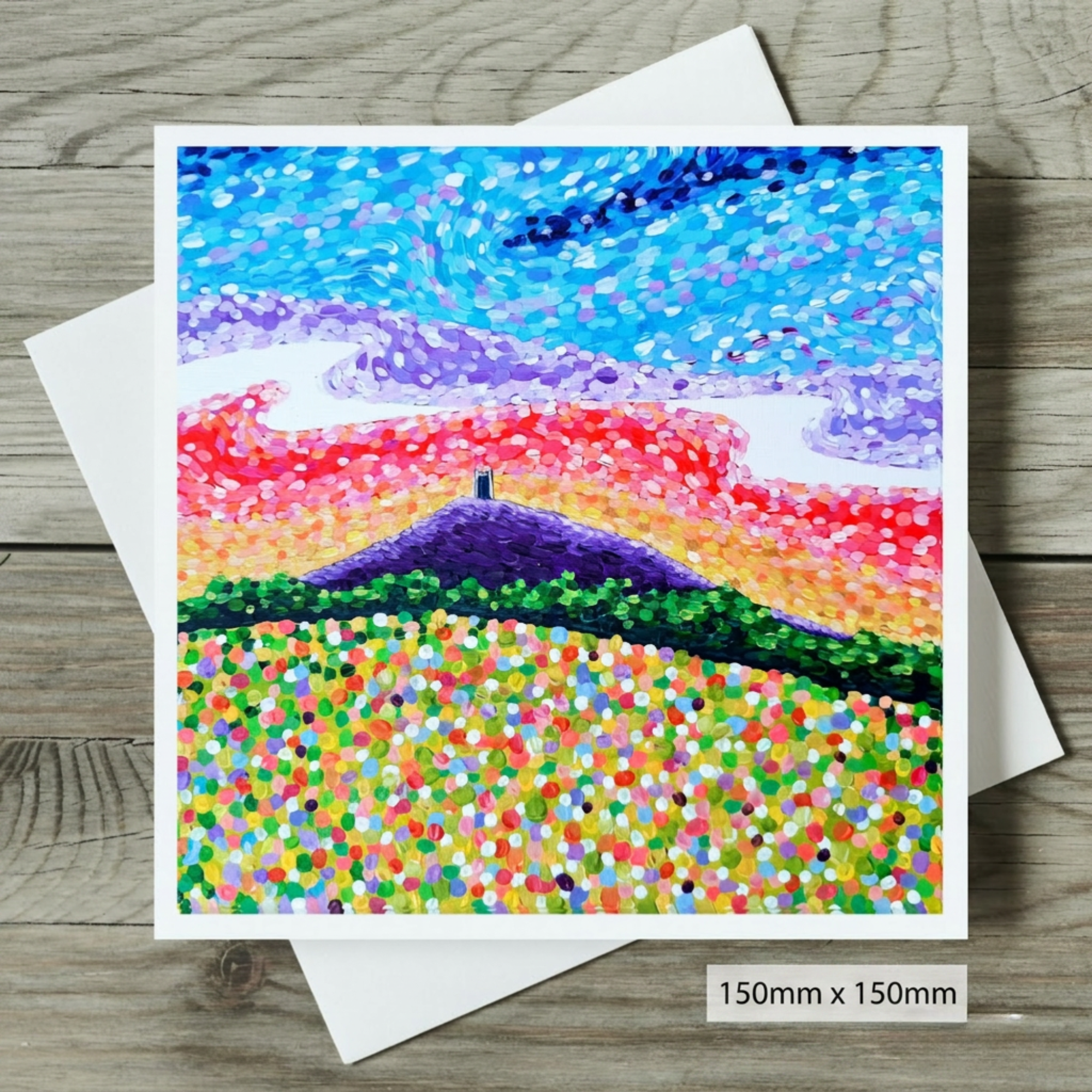 Colourful abstract painting of Glastonbury Tor on a wooden surface
