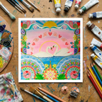 Colourful artwork of swans on a wooden surface with art supplies