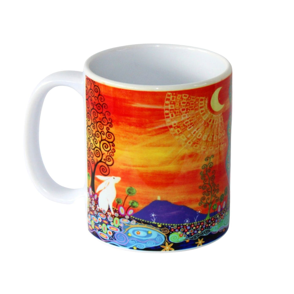 Colourful mug with artistic design of a landscape and animals on a white background