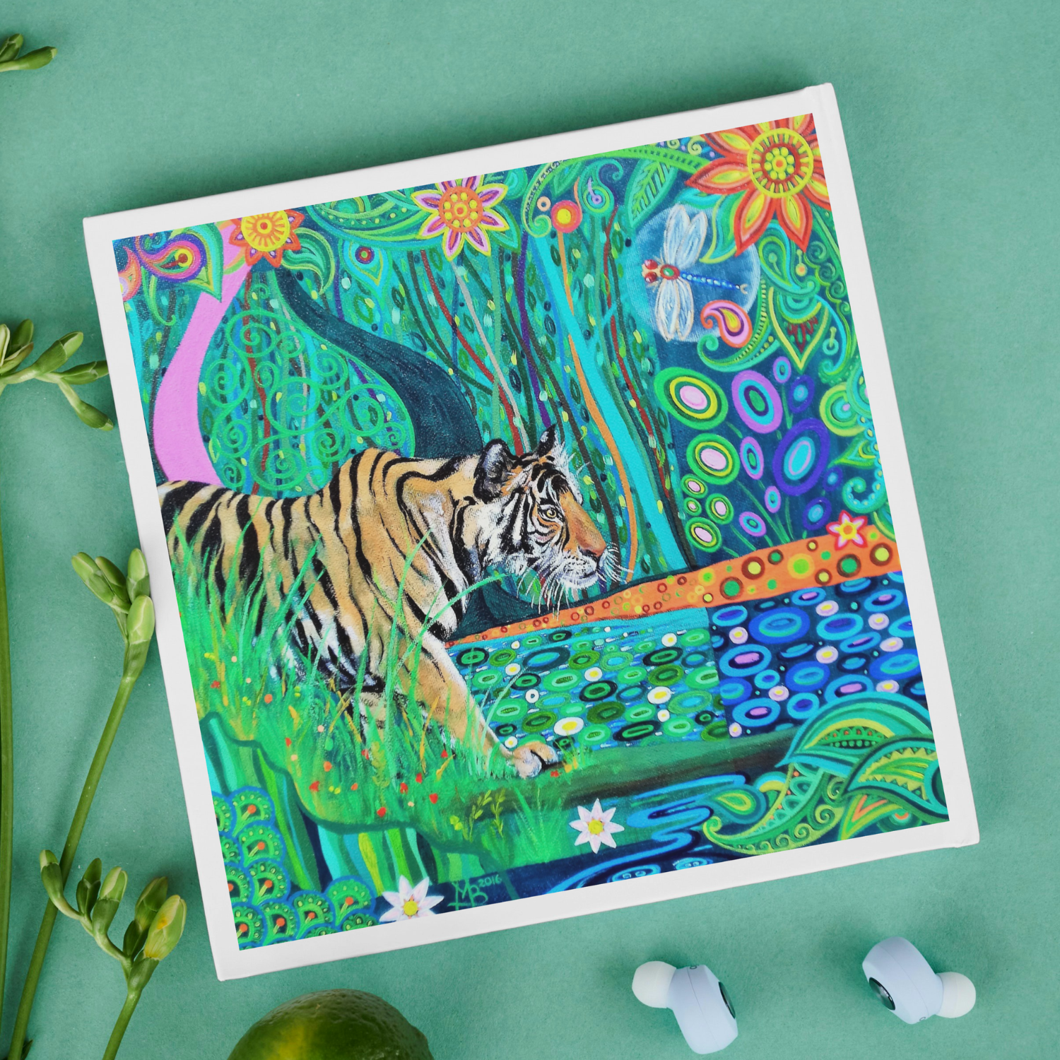 Colourful artwork of a tiger in a natural setting with flowers and plants on a green background.