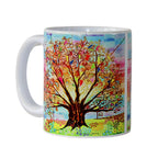 Colourful mug with a tree design on a white background
