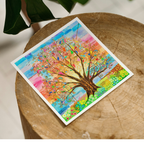 Colourful tree painting on a wooden surface