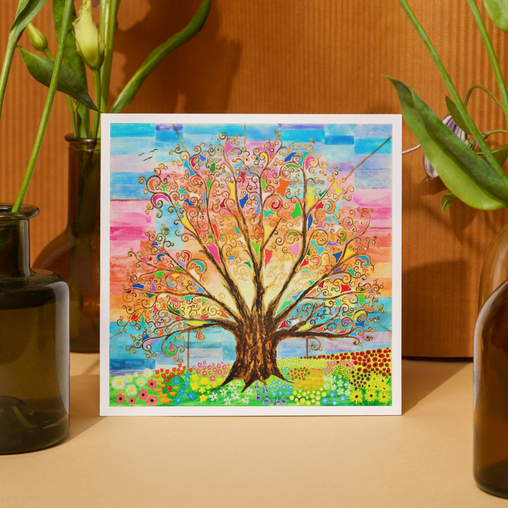 Colourful tree painting on a wooden surface with plants around