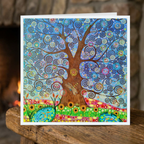 Colourful tree design on a greeting card with a blurred background
