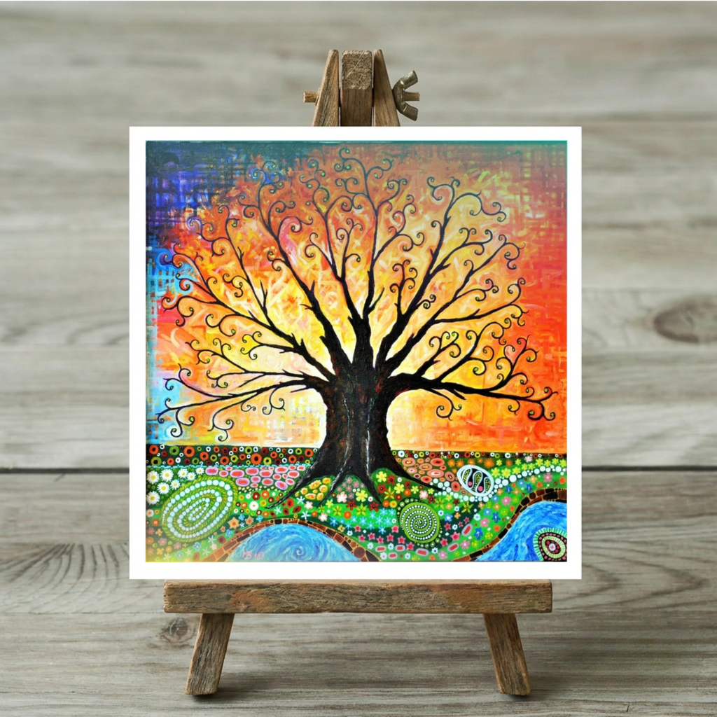 Colourful tree painting on a greeting card on a wooden easel against a wooden background