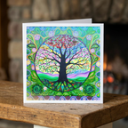 Colourful card with a tree of life  design on a wooden surface