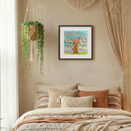 Decorative bedroom with a bed, wall art, and hanging plant.