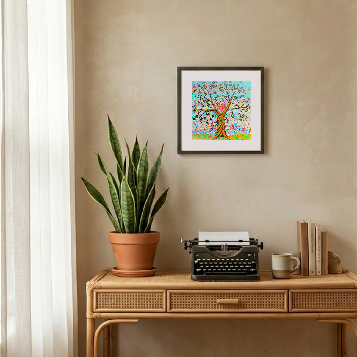 Decorative setup with a potted plant, typewriter, and framed artwork on a beige wall.