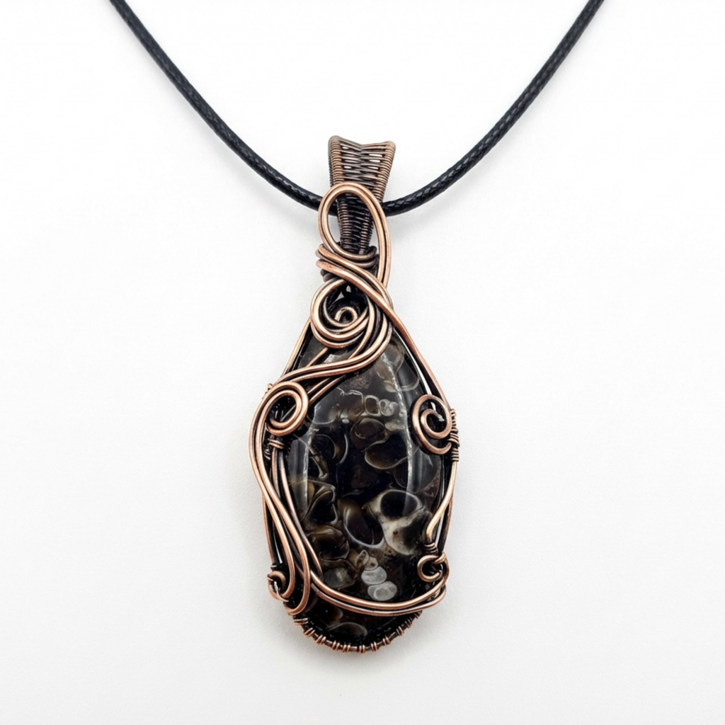Necklace with a decorative pendant on a white background