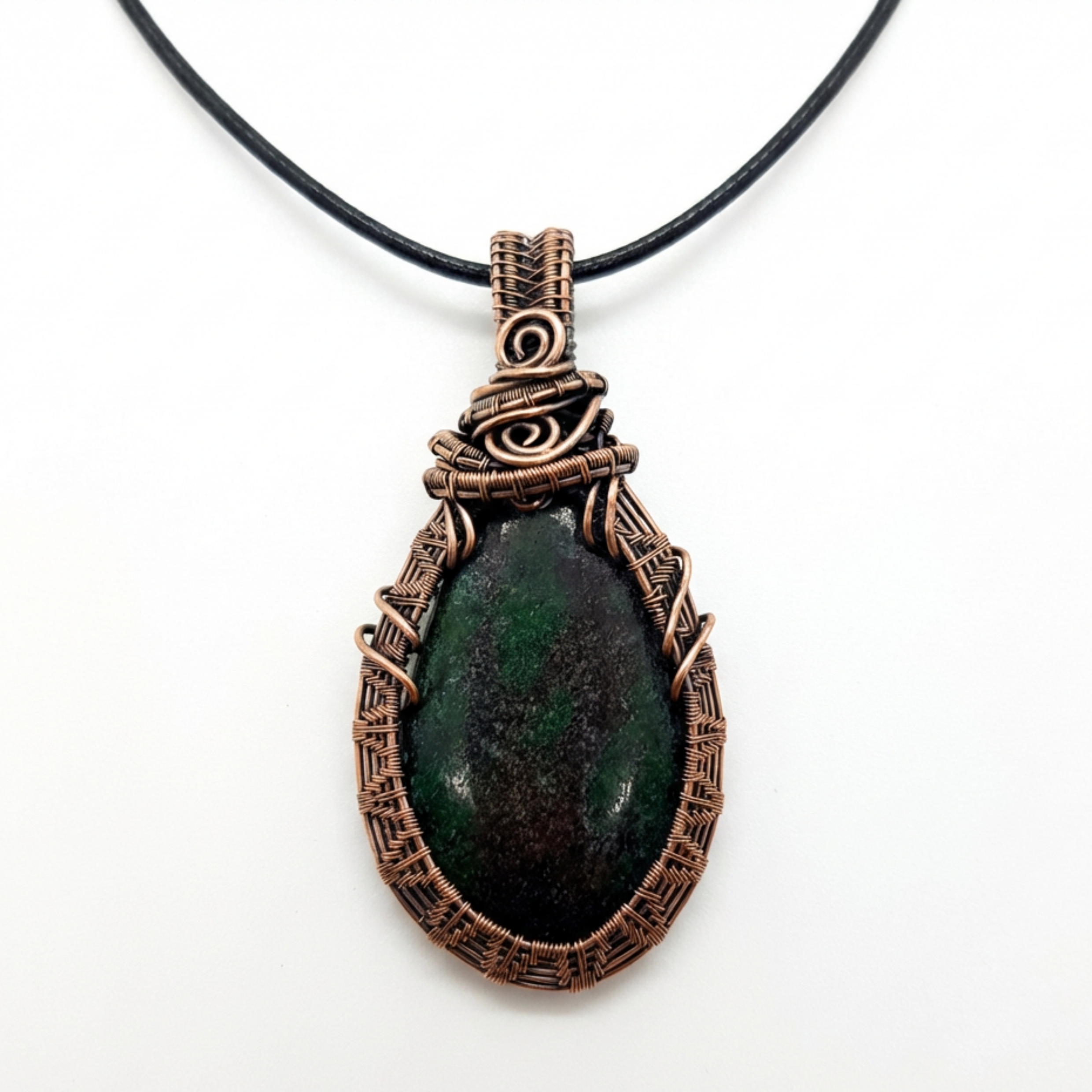 Necklace with a green stone pendant on a white background