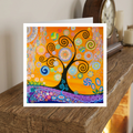 Colourful abstract card with a tree design on a wooden surface